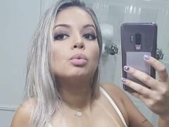 Wonderful blonde and call girl Mayara did a delicious and very sexy strip showing off her big body and big tits