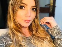 Bitch Nymphet with Huge Breasts and a Princess Face Shows Off Naked and Masturbates with a Vibrator Moaning with Pleasure