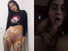 Tattooed nymphet giving a delicious blowjob