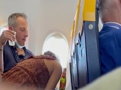 Naughty girl caught sucking the crown on the plane