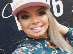 Very Provocative Bronzed Blonde Shows Off Naked in Motel Bed and Gives a Beautiful Smile