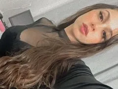 Showing off her big tits and rolling around in front of the camera