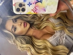 Showing off her big tits and riding a dildo