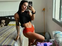 Naked showing off her big tits and masturbating her pussy