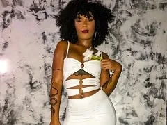 Showing off her pussy while smoking a joint