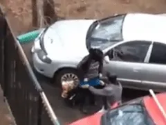Real amateur footage of a very naughty couple having sex in a parking lot during the day
